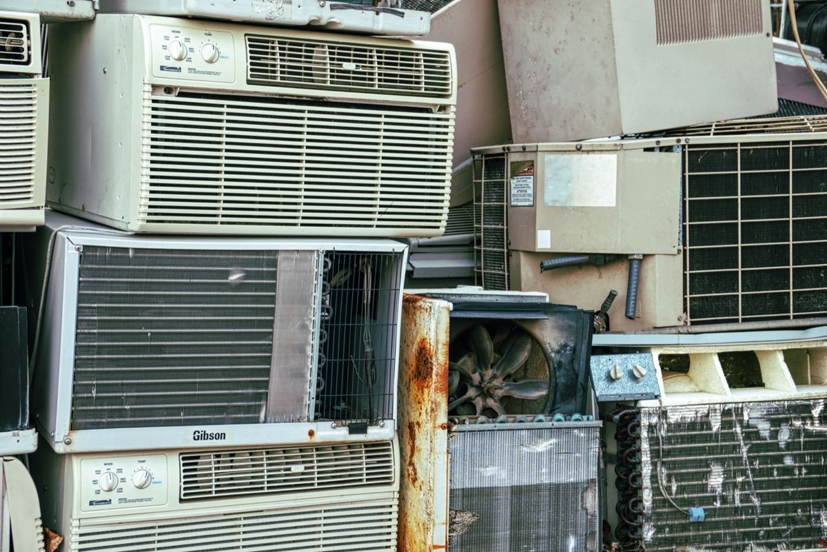 Discarded air conditioners and appliances ready for hauling